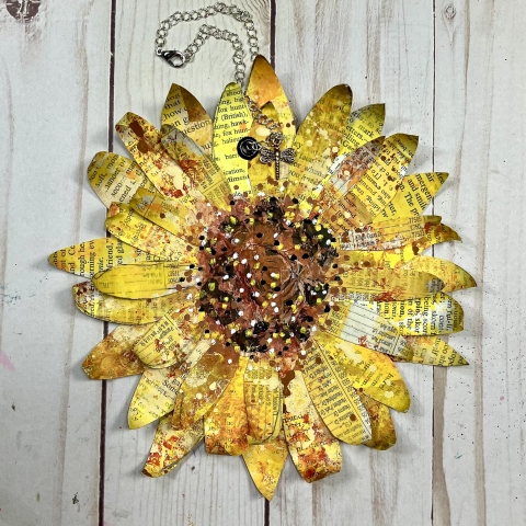 journal in the shape of a sunflower made from book pages