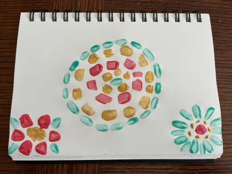 Colorful painting of flowers in Alma Thomas style in an art journal