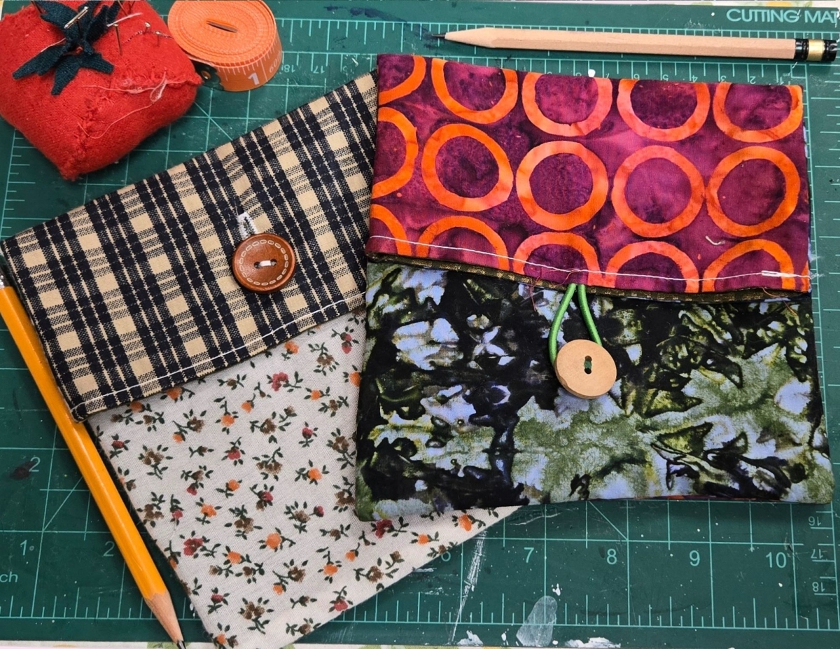 two small pouches with button closures 