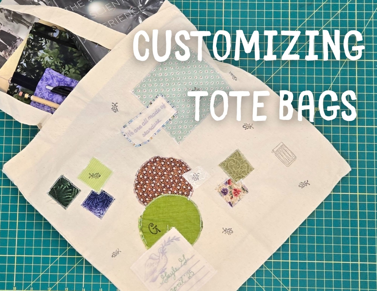 a decorated tote bag with a few books peeking out.