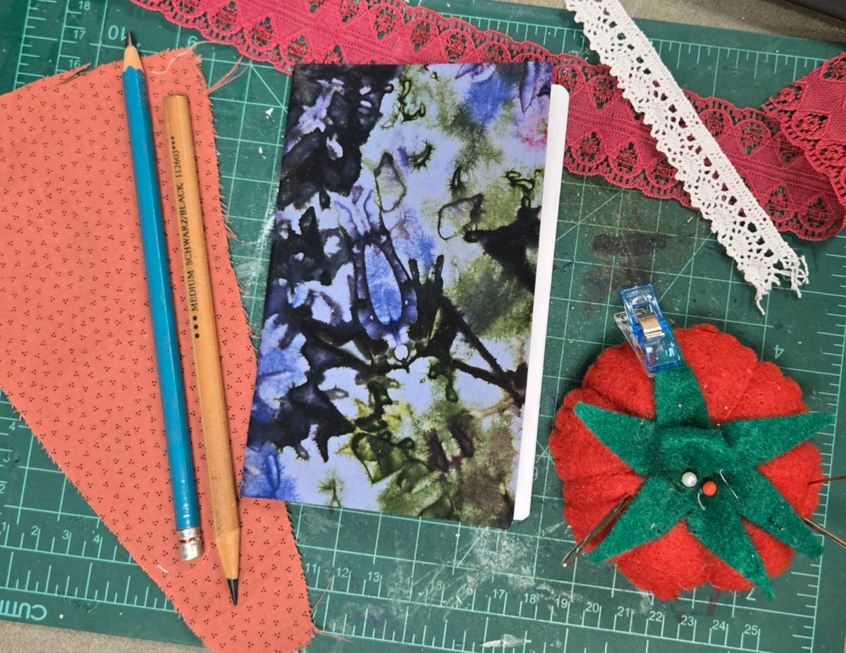 a tie-dyed fabric covered notebook 