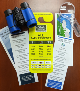 Park pass with binoculars, magnifying glass, and bookmarks.
